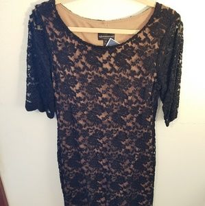 Black lace stretchy dress with nude lining.